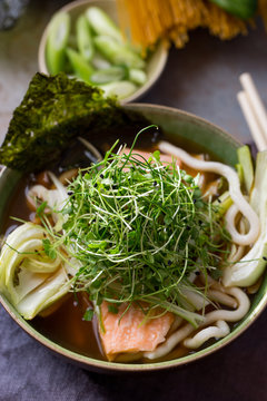 Miso broth with salmon, noodles and micro greens