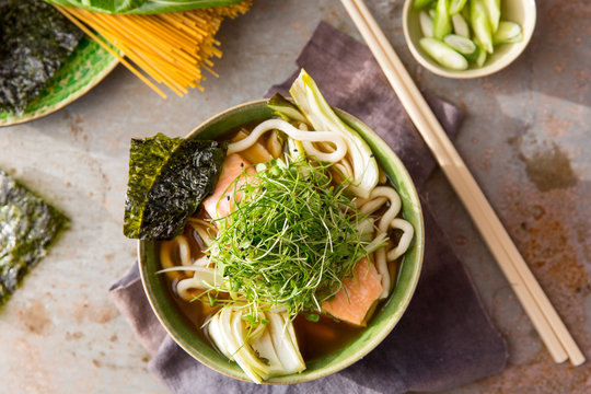Miso broth with salmon, noodles and micro greens