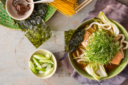 Miso broth with salmon, noodles and micro greens