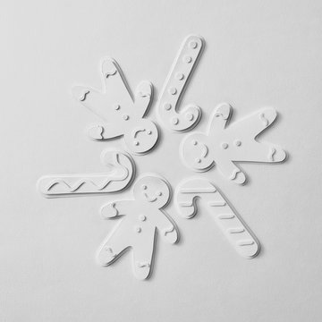 Paper volume figures of snowmen and candies in the form of a cir