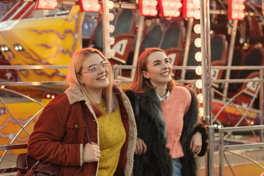 Sisters Having Fun At The Amusement Park