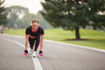 sport girl making exercises outdoors. Young sport woman in a park