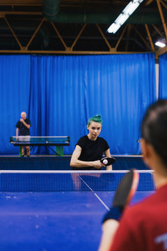 Woman in wheelchair playing table tennis