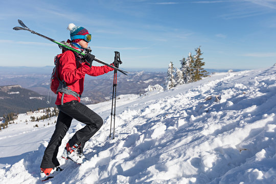 Skier walking uphill