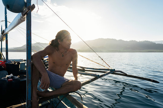 Cheerful man on fishing boat
