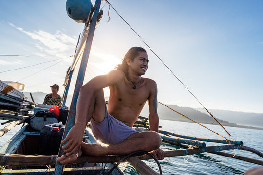 Cheerful man on fishing boat
