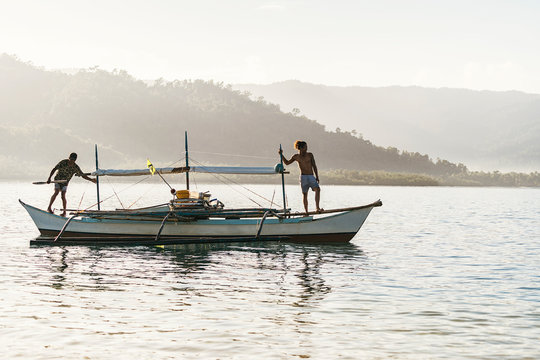 Cheerful man on fishing boat