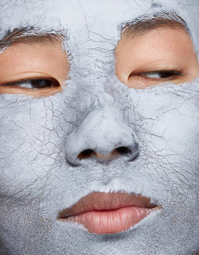 Closeup photo woman with clay mask