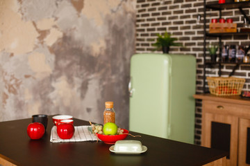 Christmas decorated kithen in loft style. Black, green and red colors. Modern loft style of interior decorated for New Year Eve