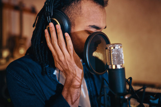 Young Singer Working On His Music In A Recording Studio