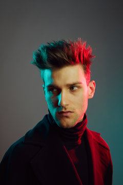 Close up of young man in studio.