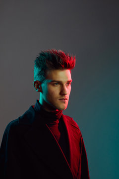 Close up of young man in studio.