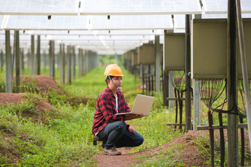 Engineers inspect at solar power stations in Asia