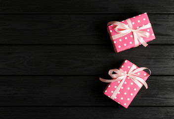 top view of a gift box on a black wooden background