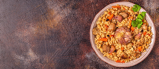Pilaf with meat, vegetables and spices.