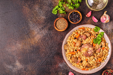 Pilaf with meat, vegetables and spices.