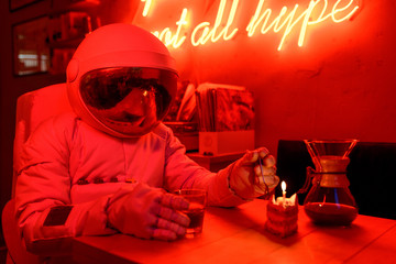 Astronaut celebrating birthday in cafe
