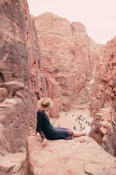 Tourist exploring Jordanian ancient city Petra
