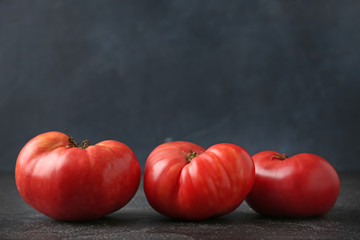 Fresh tomatoes on dark background