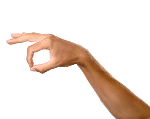 Male hand showing OK gesture on white background