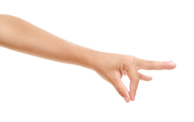 Child's hand holding something on white background