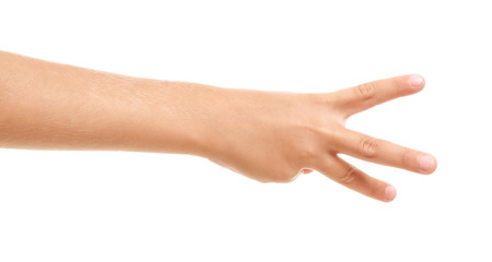 Child's hand showing three fingers on white background