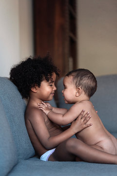 Portrait of beautiful siblings playing at home