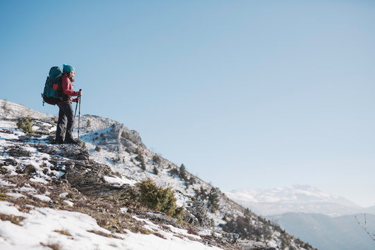 hiker with sticks enjoying the view