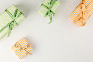 Gift box with ribbon on white background top view.