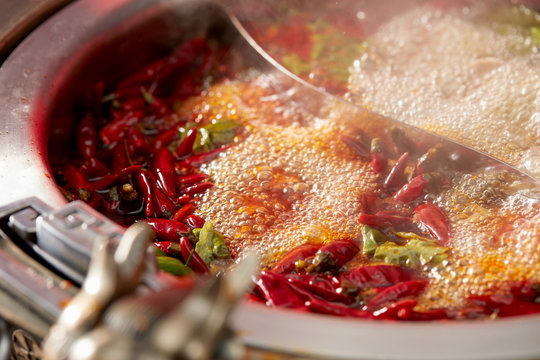 Traditional Chinese Sichuan Spicy Hot Pot, Closeup Boiling Soup