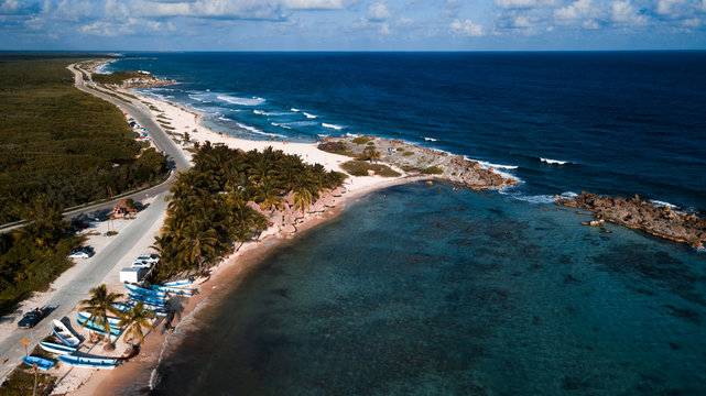 boat parking on the beach of caribbean sea shot with drone