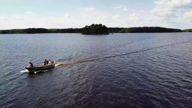 Aerial footage of a boat on the lake in the Färnebofjärdens Nationalpark in Sweden.