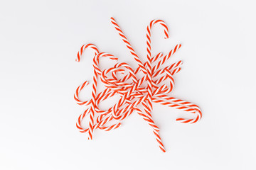 Candy cane on a white background. Christmas sweets.