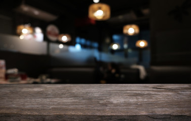 Wood Table Top in Blur Background room interior with empty copy space.