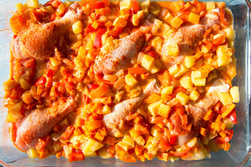 Stewed chicken legs with vegetables and sauce