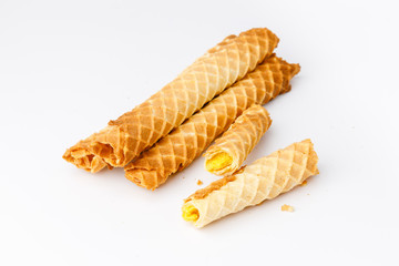 Baked waffles with yellow fruit filling on white background