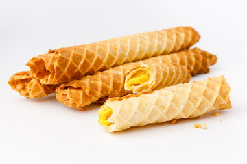 Baked waffles with yellow fruit filling on white background