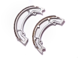 Motorcycle brake pads on a white background.