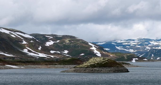 Oppland, Tyin Lake, Norway. Stones On Coast Of Beautiful Lake Tyin In Summer Cloudy Day. Norwegian Nature