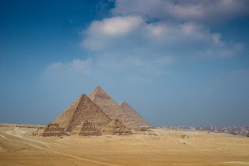 Fototapeta na wymiar The Giza pyramid complex with the three main pyramids and subsidiary pyramids are located on the Giza Plateau, near Cairo, Egypt 