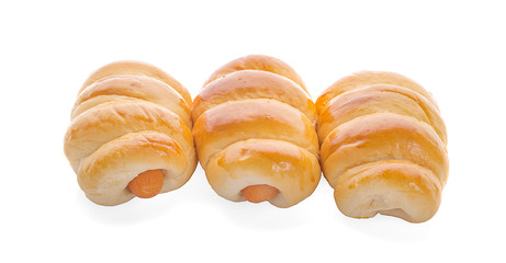 Fresh hot crusty bread rolls. Sausages in dough