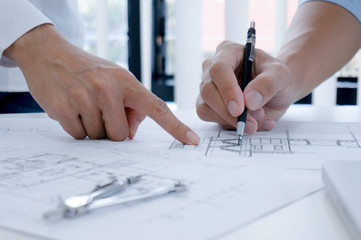 Colleagues interior designer Corporate Achievement Planning Design on blueprint Teamwork Concept...