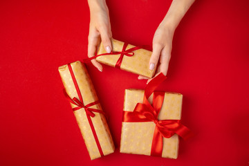 Preparing for Christmas holidays, woman with a gift in her hands