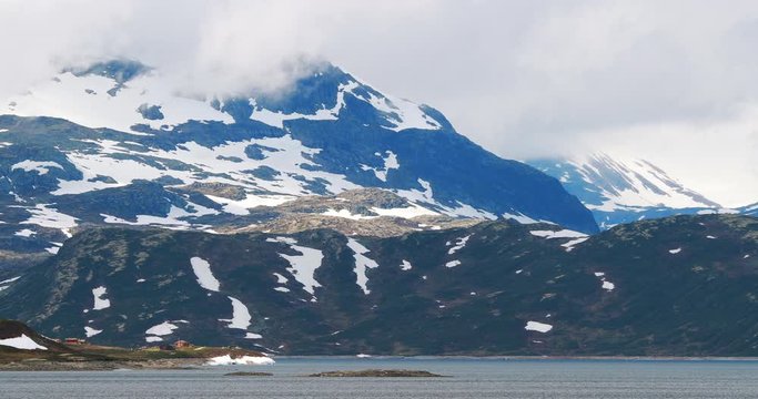 Oppland, Tyin Lake, Norway. Stones On Coast Of Beautiful Lake Tyin In Summer Cloudy Day. Norwegian Nature