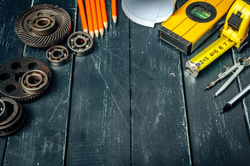 Machine engineer tools set on dark wooden background