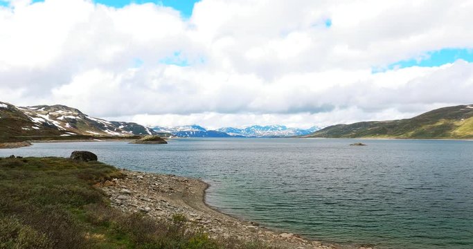 Oppland, Tyin Lake, Norway. Stones On Coast Of Beautiful Lake Tyin In Summer Cloudy Day. Norwegian Nature