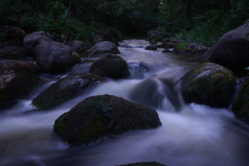 Water flowing in river in summer night