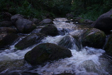 Water flowing in river in summer night