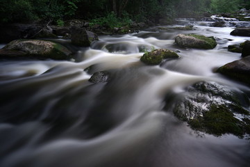 Water streaming in river in summer night