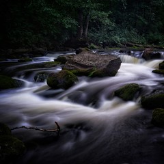 Water streaming in river in summer night